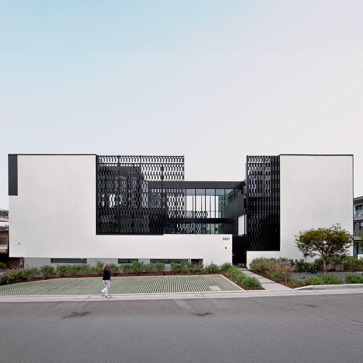 Modern residential home with clean white facade and sustainable design in Manhattan Beach